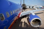 Our 737-700 sits in its slot just ahead of the giant C-5 Galaxy after arrival at AirVenture 2012
